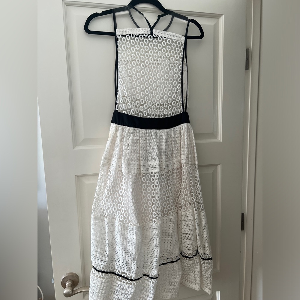 Kendall and Kylie white poplin dress w black trim.